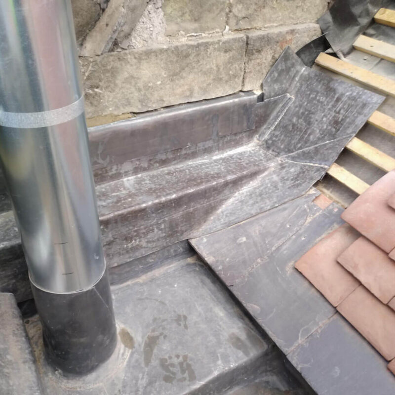 Exterior view of a building with clear evidence of moisture prevention and leadwork installation services